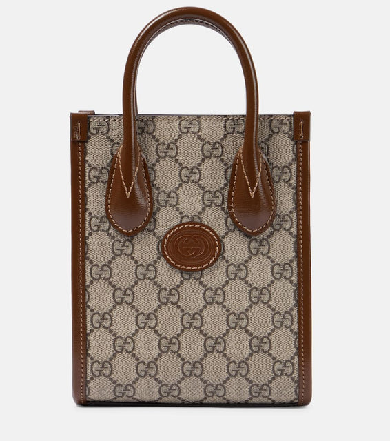 Gucci GG Supreme Mini canvas tote. Shop Gucci Top-Handle Bags for women now.