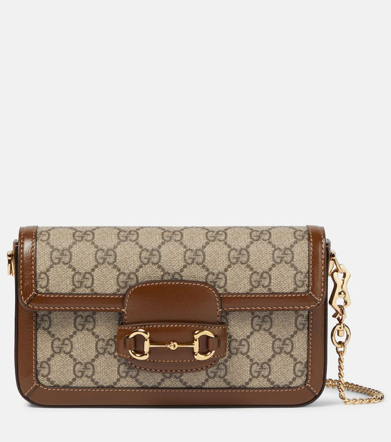 Gucci Gucci Horsebit 1955 canvas clutch. Shop Gucci Clutches for women now.