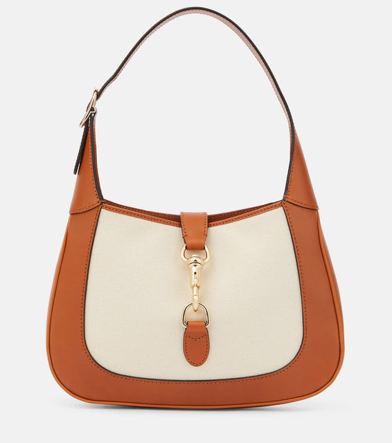 Gucci Gucci Jackie Small leather-trimmed shoulder bag. Shop Gucci Shoulder Bags for women now.