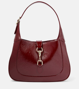 Gucci Gucci Jackie Small patent leather shoulder bag. Shop Gucci Shoulder Bags for women now.