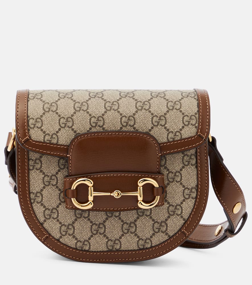 Gucci Horsebit 1955 Mini GG canvas shoulder bag. Shop Gucci Shoulder Bags for women now.