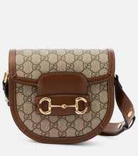 Gucci Horsebit 1955 Mini GG canvas shoulder bag. Shop Gucci Shoulder Bags for women now.