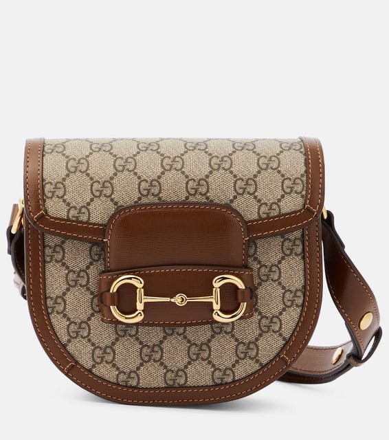 Gucci Horsebit 1955 Mini GG canvas shoulder bag. Shop Gucci Shoulder Bags for women now.