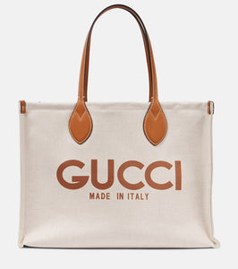 Gucci Medium logo leather-trimmed canvas tote bag. Shop Gucci Tote Bags for women now.