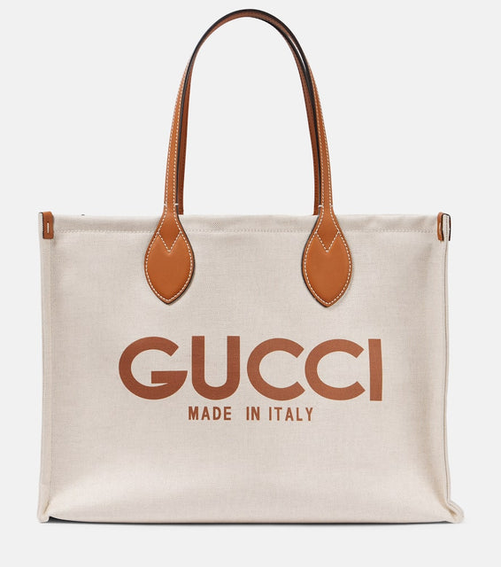 Gucci Medium logo leather-trimmed canvas tote bag. Shop Gucci Tote Bags for women now.