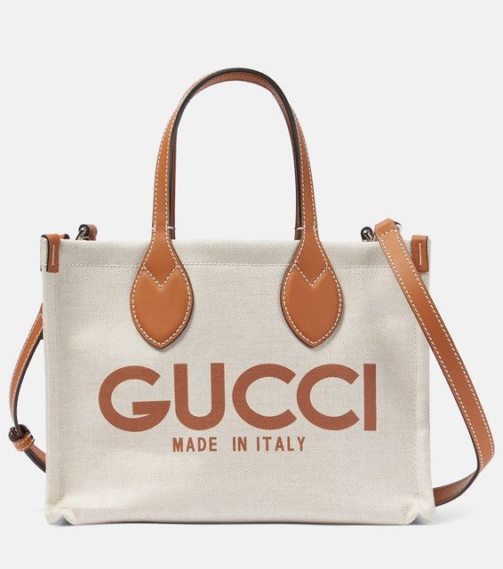 Gucci Mini logo leather-trimmed canvas tote bag. Shop Gucci Tote Bags for women now.