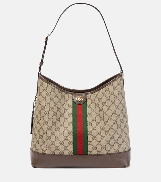 Gucci Ophidia GG Medium canvas shoulder bag. Shop Gucci Shoulder Bags for women now.