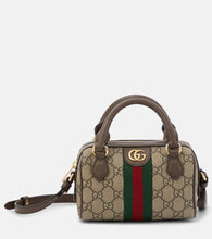 Gucci Ophidia Mini GG canvas crossbody bag. Shop Gucci Shoulder Bags for women now.