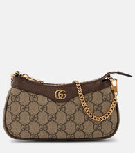 Gucci Ophidia Mini GG canvas shoulder bag. Shop Gucci Shoulder Bags for women now.