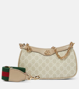 Gucci Ophidia Small GG canvas shoulder bag. Shop Gucci Shoulder Bags for women now.
