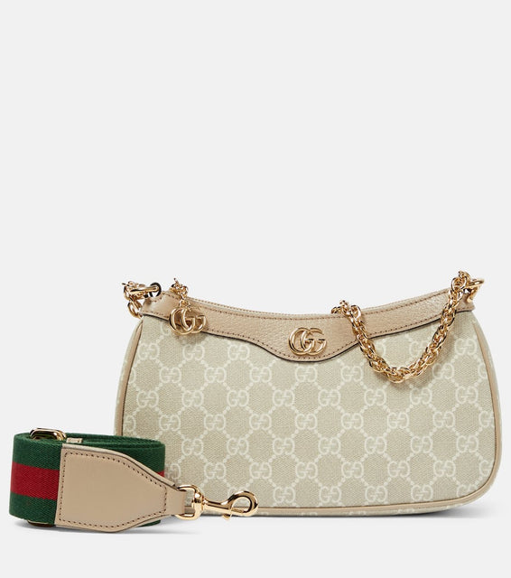 Gucci Ophidia Small GG canvas shoulder bag. Shop Gucci Shoulder Bags for women now.