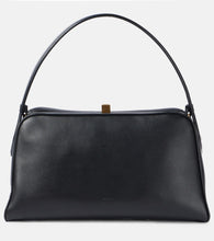 Khaite Cate leather shoulder bag. Shop Khaite Top-Handle Bags for women now.
