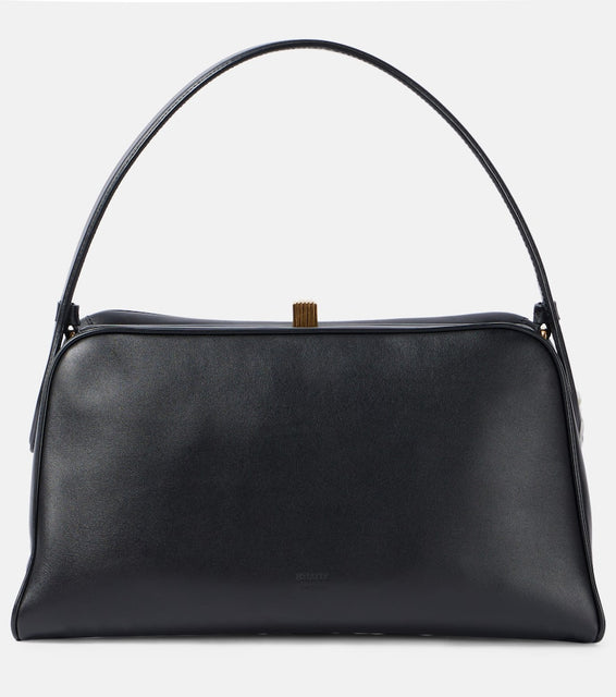 Khaite Cate leather shoulder bag. Shop Khaite Top-Handle Bags for women now.