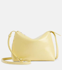 Khaite Lina leather crossbody bag. Shop Khaite Clutches for women now.