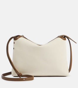 Khaite Lina leather-trimmed canvas crossbody bag. Shop Khaite Clutches for women now.