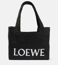 Loewe Paula's Ibiza Medium logo raffia tote bag. Shop Loewe Tote Bags for women now.