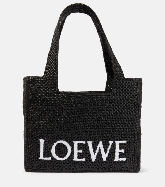 Loewe Paula's Ibiza Medium logo raffia tote bag. Shop Loewe Tote Bags for women now.
