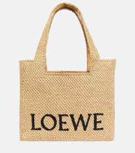 Loewe Paula's Ibiza Medium logo raffia tote bag. Shop Loewe Tote Bags for women now.