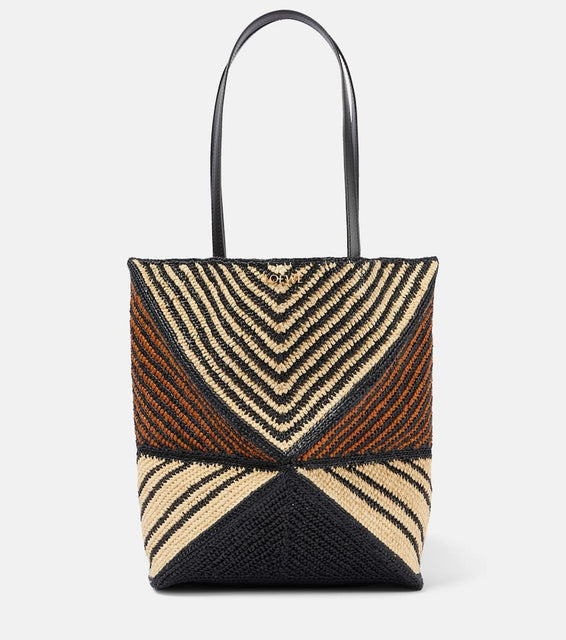 Loewe Paula's Ibiza Puzzle Fold Medium raffia tote bag. Shop Loewe Tote Bags for women now.
