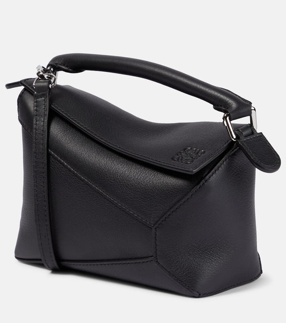 Loewe Puzzle Edge Mini leather shoulder bag. Shop Loewe Top-Handle Bags for women now.