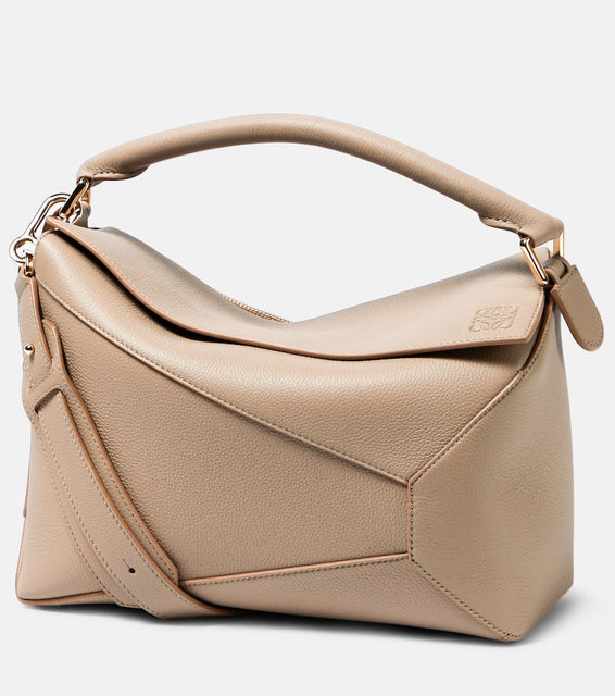 Loewe Puzzle Edge leather shoulder bag. Shop Loewe Top-Handle Bags for women now.