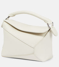 Loewe Puzzle Mini leather shoulder bag. Shop Loewe Top-Handle Bags for women now.
