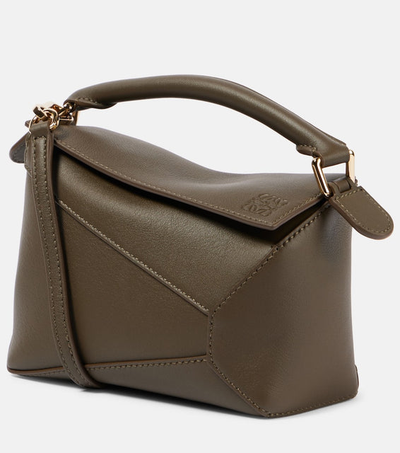 Loewe Puzzle Mini leather shoulder bag. Shop Loewe Top-Handle Bags for women now.