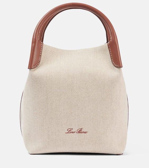 Loro Piana Bale Small leather-trimmed canvas tote bag. Shop Loro Piana Bucket Bags for women now.