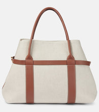 Loro Piana Ghiera Large leather-trimmed canvas shopper. Shop Loro Piana Tote Bags for women now.