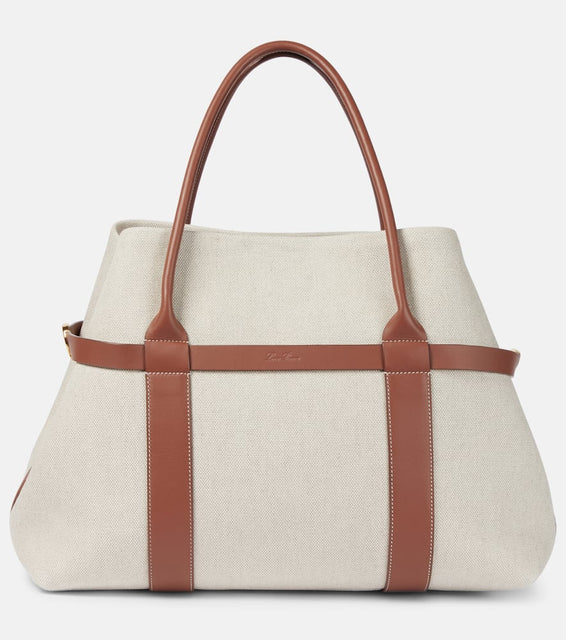 Loro Piana Ghiera Large leather-trimmed canvas shopper. Shop Loro Piana Tote Bags for women now.