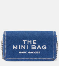 Marc Jacobs The Mini denim crossbody bag. Shop Marc Jacobs Crossbody Bags for women now.