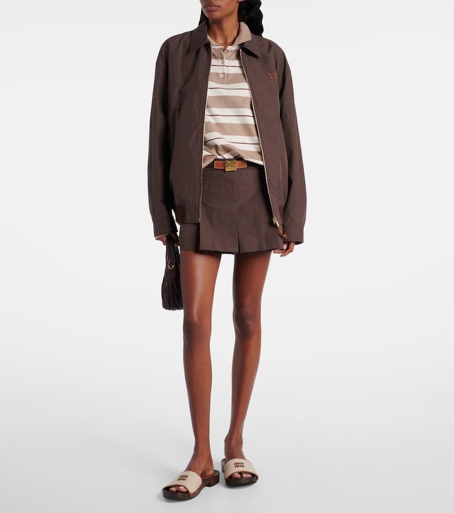 Miu Miu Logo leather-trimmed canvas clogs in Beige - Slides