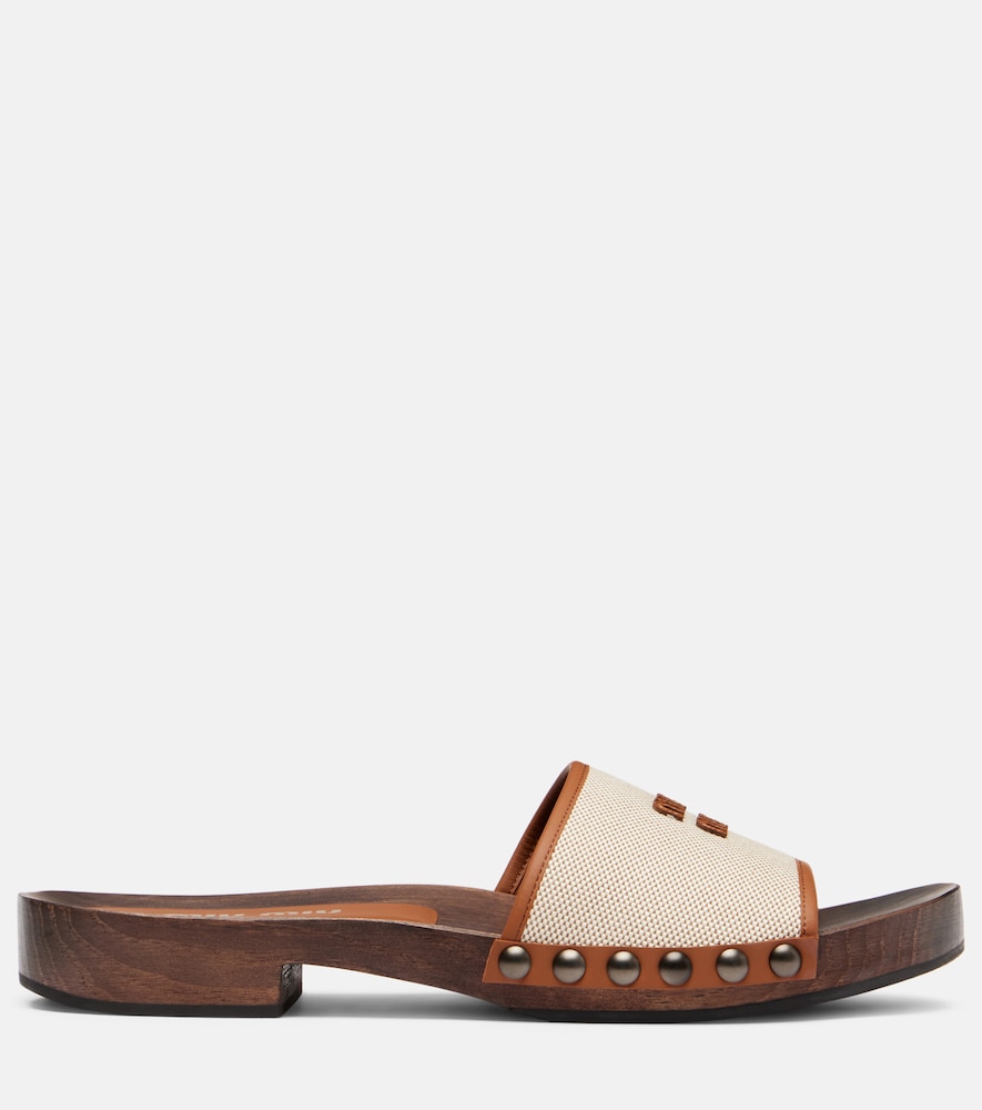 Miu Miu Logo leather-trimmed canvas clogs in Beige - Slides