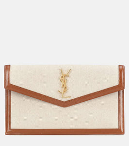 Saint Laurent Uptown canvas clutch. Shop Saint Laurent Clutches for women now.