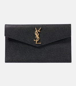 Saint Laurent Uptown leather clutch. Shop Saint Laurent Clutches for women now.