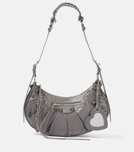 Balenciaga Le Cagole Small leather shoulder bag. Shop Balenciaga Shoulder Bags for women now.
