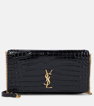 Saint Laurent Cassandre leather phone pouch. Shop Saint Laurent Shoulder Bags for women now.