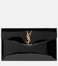 Saint Laurent Uptown patent leather clutch. Shop Saint Laurent Clutches for women now.
