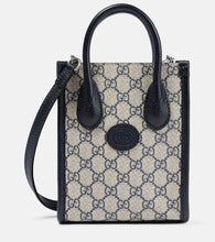 Gucci GG Supreme Mini canvas tote. Shop Gucci Top-Handle Bags for women now.