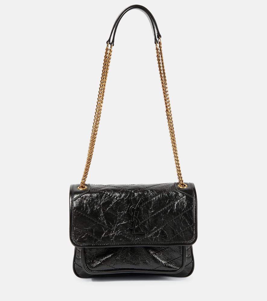 Saint Laurent Niki Baby leather shoulder bag. Shop Saint Laurent Shoulder Bags for women now.