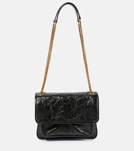 Saint Laurent Niki Baby leather shoulder bag. Shop Saint Laurent Shoulder Bags for women now.