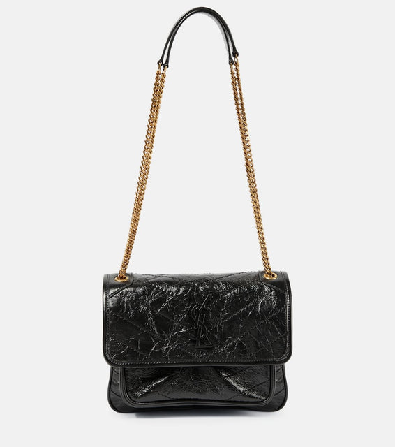 Saint Laurent Niki Baby leather shoulder bag. Shop Saint Laurent Shoulder Bags for women now.