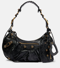 Balenciaga Le Cagole Small leather shoulder bag. Shop Balenciaga Shoulder Bags for women now.