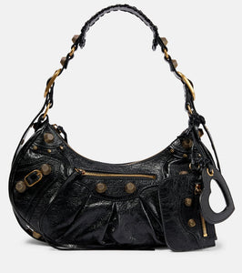 Balenciaga Le Cagole Small leather shoulder bag. Shop Balenciaga Shoulder Bags for women now.
