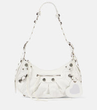 Balenciaga Le Cagole Small leather shoulder bag. Shop Balenciaga Shoulder Bags for women now.