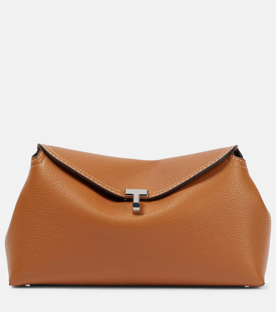 Toteme T-Lock leather clutch. Shop Toteme Clutches for women now.