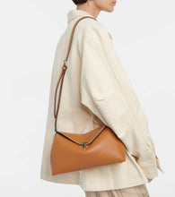 Toteme T-Lock leather clutch