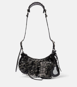Balenciaga Le Cagole XS leather shoulder bag. Shop Balenciaga Shoulder Bags for women now.