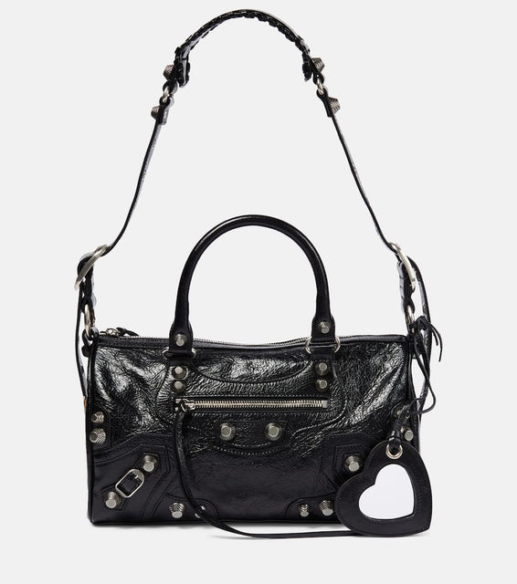 Balenciaga Neo Cagole leather duffel bag. Shop Balenciaga Shoulder Bags for women now.