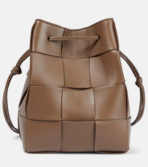 Bottega Veneta Cassette Small leather bucket bag. Shop Bottega Veneta Bucket Bags for women now.